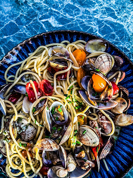 Clams, pasta, and tomatoes creating a delicious italian seafood dish