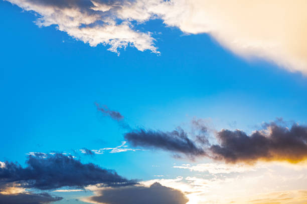 Vivid blue skies collide with glowing orange clouds