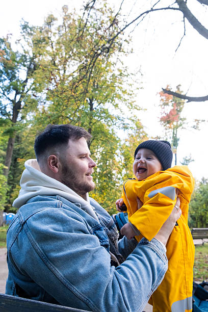istock Father and Child Bonding in Autumn Park 2245317733