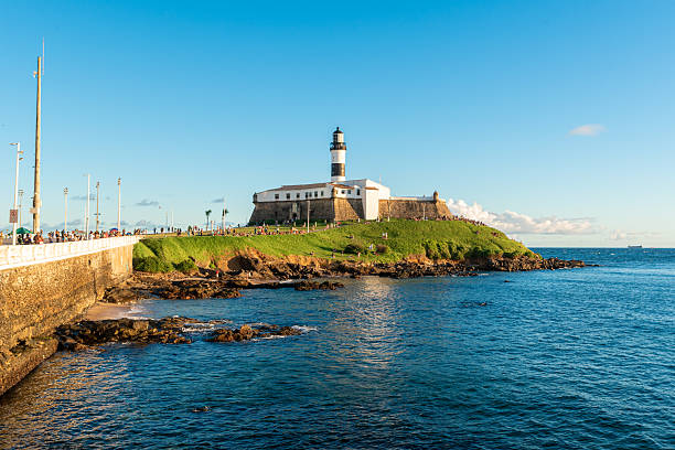 Salvador, Brazil - July 22, 2025: Famous Farol da Barra lighthouse. It was the first nautical signaling system to come into operation in the Americas.