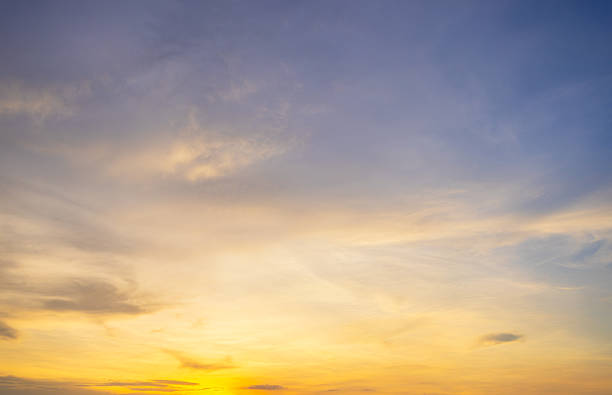 istock Orange sky and clouds backdrop at sunset and sunrise,Sky,sunset, beautiful , luxury soft gradient orange gold clouds and sunlight on the blue sky perfect for the background, Sunrise on morning or everning in winter warm time. 2245319672