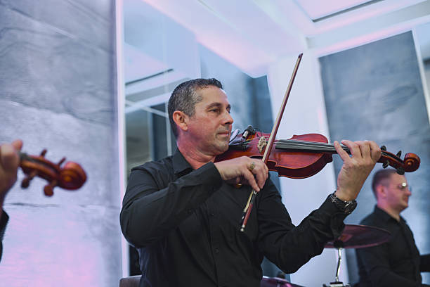 Violinist Plays Live With Band During Evening Session