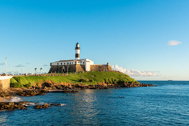 Salvador, Brazil - July 22, 2025: Famous Farol da Barra lighthouse. It was the first nautical signaling system to come into operation in the Americas.