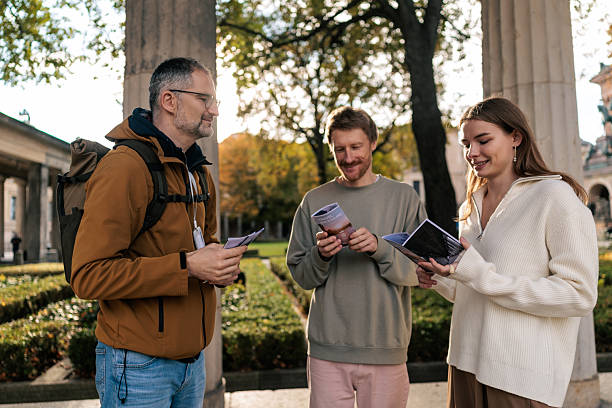istock Couple Discussing Travel Plans with Tour Guide in Berlin 2245321065
