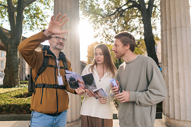 istock Tour Guide Explaining City Landmarks to Couple in Berlin 2245321739