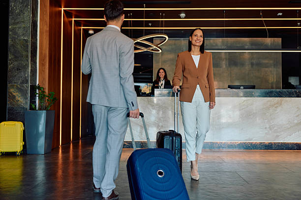 istock Business couple checking in hotel reception lobby 2245323594