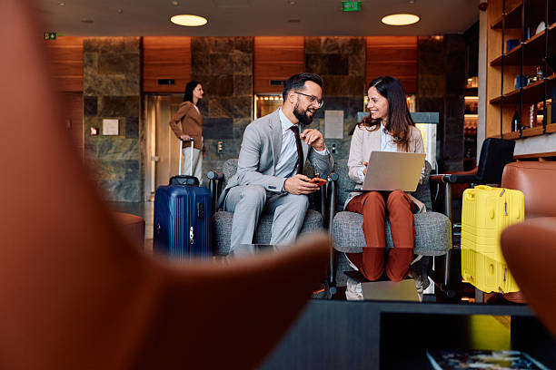 istock Business colleagues waiting in modern hotel lobby 2245323649