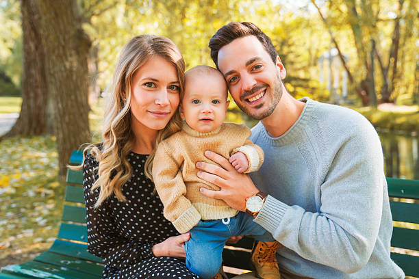 istock Family with a baby having fun in the forest. 2245323794