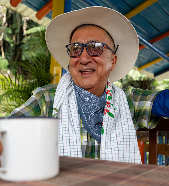 Coffee farmer drinking coffee on his farm