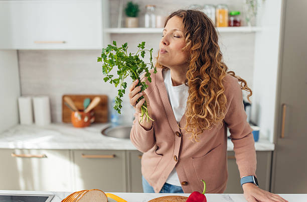 istock A Joyful Cook Enjoying Fresh Herbs in Kitchen 2245325346