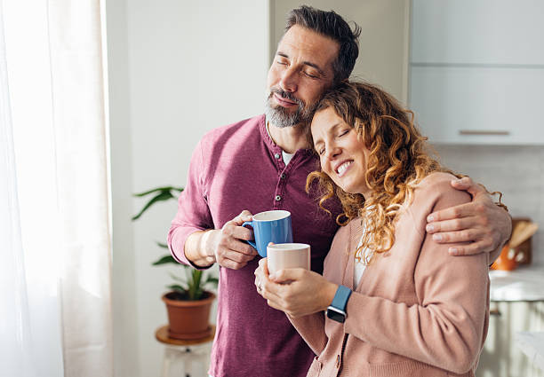 istock Couple Enjoying Coffee with Eyes Closed Blissfully 2245326356