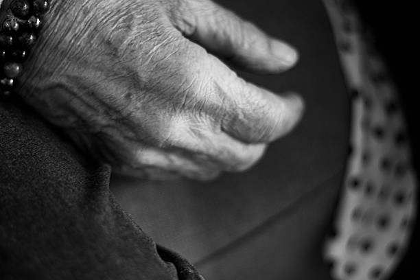 Wrinkled hand of a senior adult person reflecting the passage of time