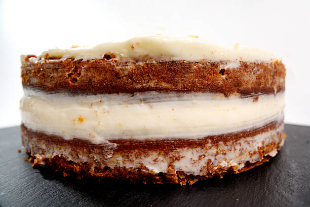 Carrot cake on wooden table. No people