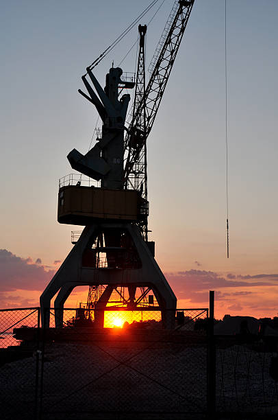 istock Cargo crane on a sunset in the port, Nikopil, Ukraine 2245331390