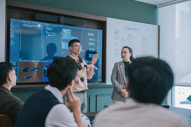istock Deaf Asian Professional Giving Presentation with Sign Language Interpreter in Office Meeting 2245331724