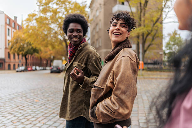 istock Friends Walking and Laughing Together Outdoors 2245332021