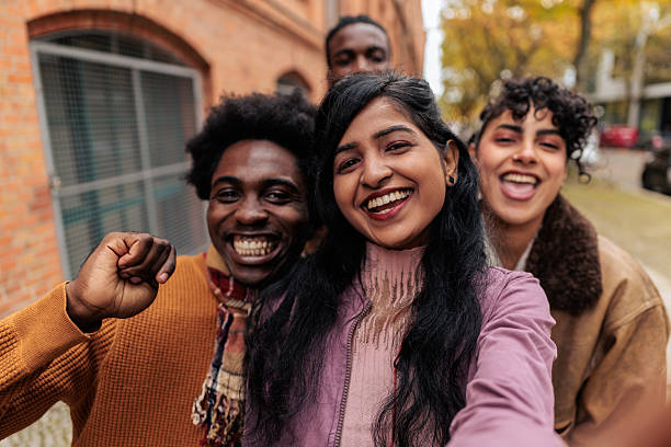 istock Excited Friends Taking Selfie and Having Fun Outdoors 2245332929
