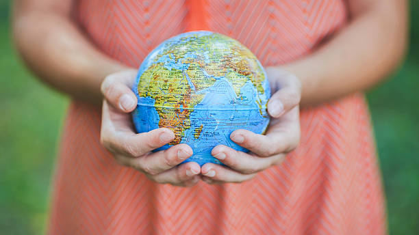 istock The little one is holding a geographic globe. 2245333056