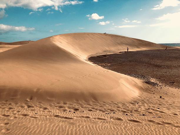 istock Evening rest over the sand dune. Tourists leave and the golden silence returns. 2245335633