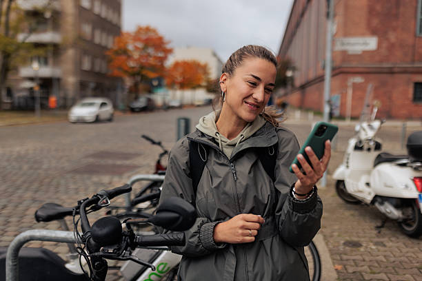 istock Woman Using Smartphone Outdoors 2245335789