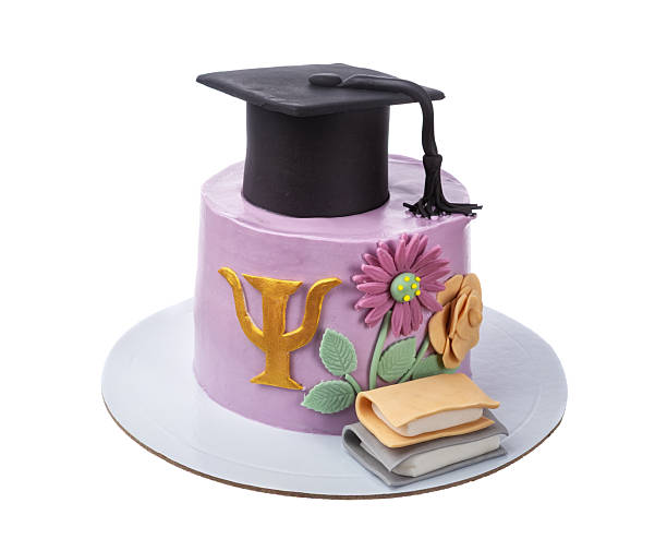 Graduation cap, cord and tassel on the lid of an old used toolbox.