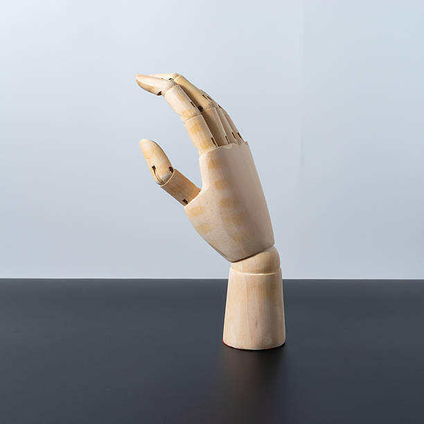 istock Wooden hand model show on black and white background 2245336660