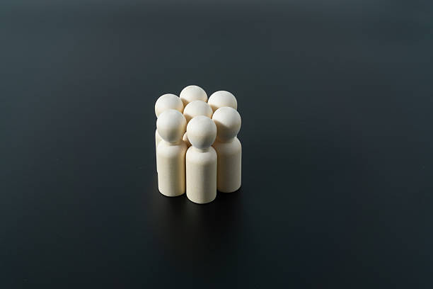 istock Wooden doll figures show the grouping concept 2245336832