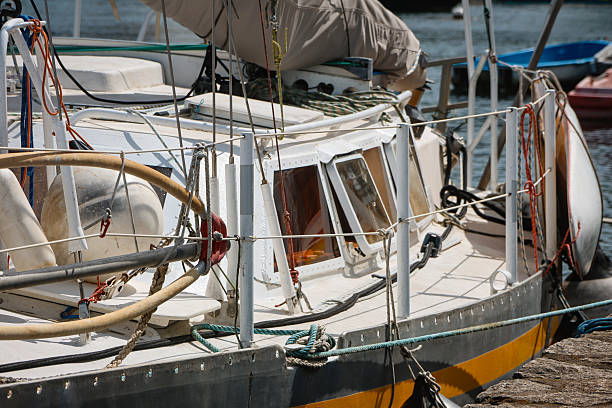 Sailboat moored at the dock in the Gulf of Morbihan, ready to head out to sea.