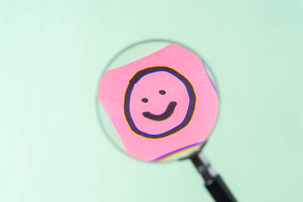 istock Magnifying glass show the smile emoji 2245336963