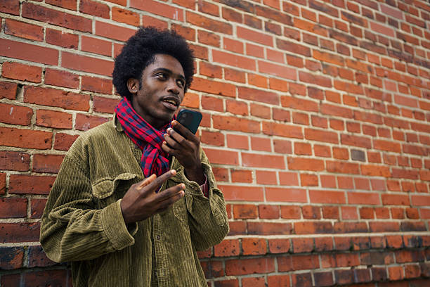 istock Stylish Man Talking on Smartphone Outdoors 2245338317