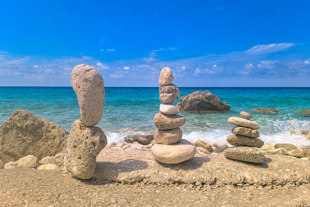 istock Made of stone tower on the beach. Balanced pebbles on beach 2245341306