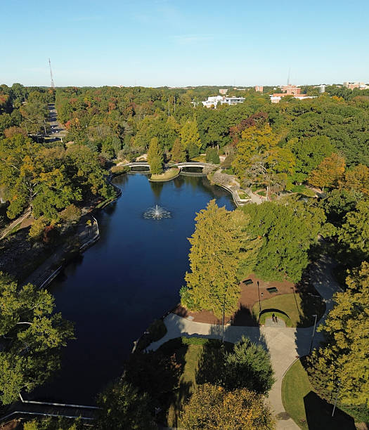 istock Fall foliage at Pullen Park in Raleigh with NC State University in the distance 2245346839