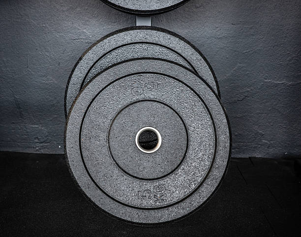 istock barbell discs in  an athletic gym 2245347498