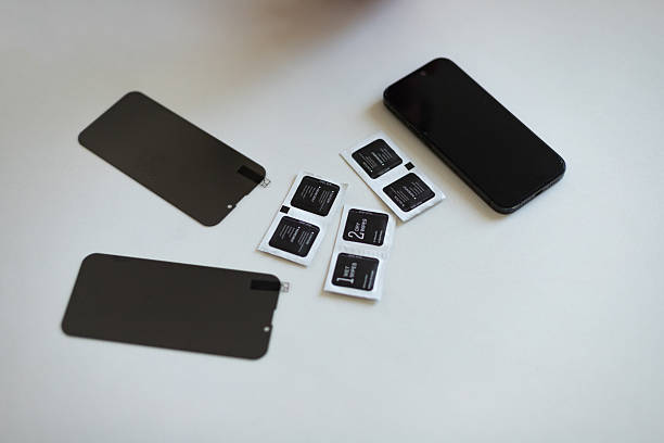 istock The process of replacing a protective glass on a smartphone 2245347854