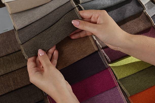 istock Woman choosing fabric among different samples indoors, above view 2245348899
