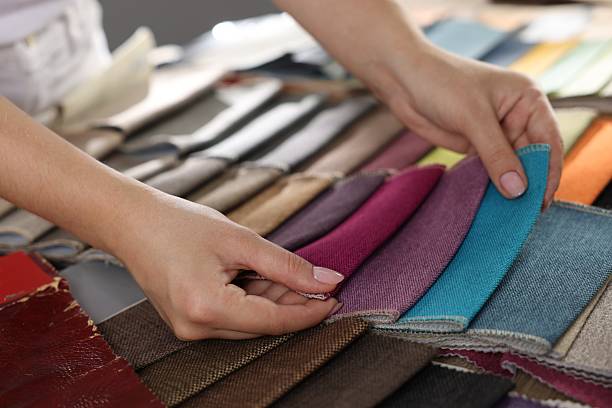 istock Woman choosing fabric among different samples indoors, closeup 2245349036