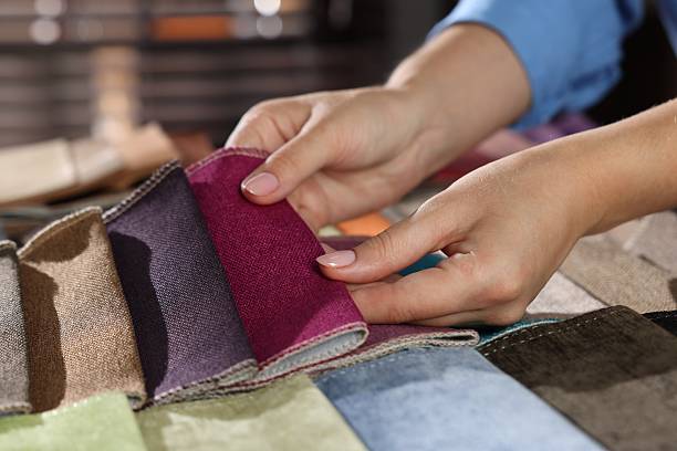 istock Woman choosing fabric among different samples indoors, closeup 2245349138