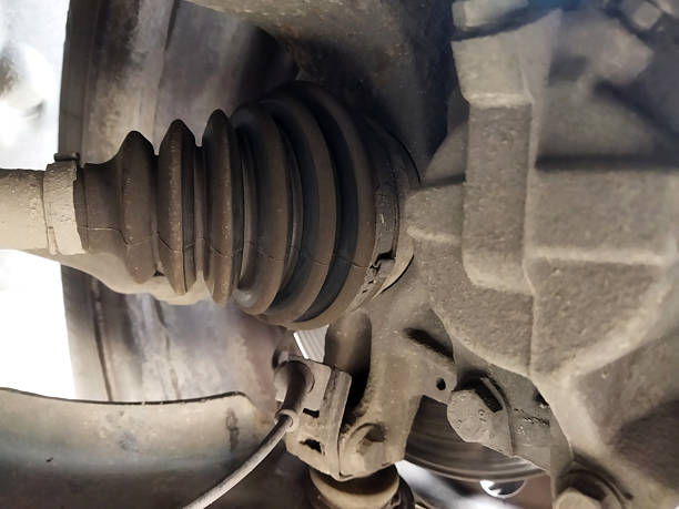 istock Boot repair on vehicle axle during maintenance session 2245349766