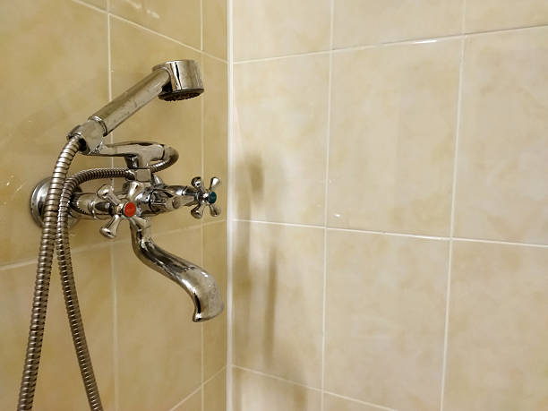 istock Modern shower faucet with sleek design in bright bathroom setting 2245349840