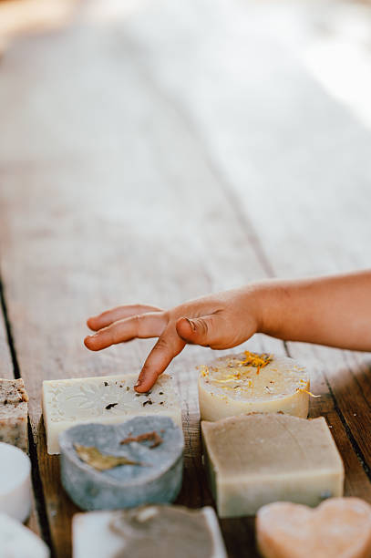 istock family shops discovering different soap samples, child investigates various soap options at market 2245355030