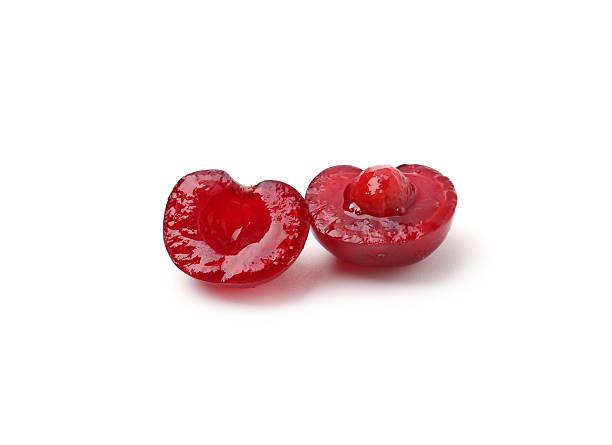 istock Halves of ripe red cherry isolated on white 2245357949