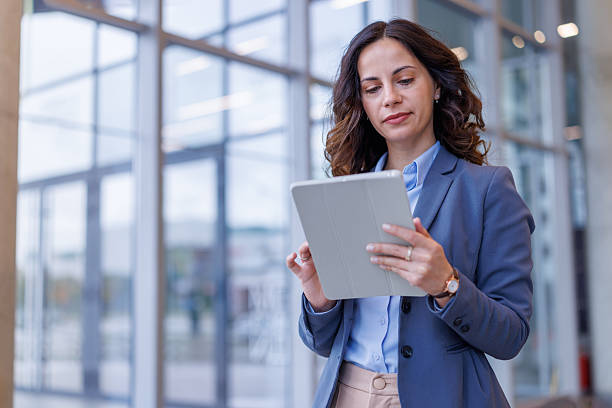 istock Businesswoman using digital tablet in modern office 2245358324