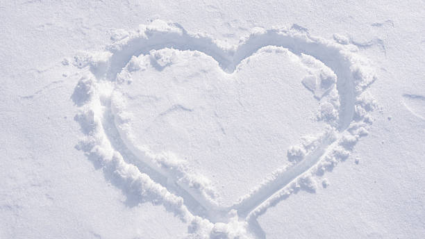 istock Heart on snowy ground. Winter romantic theme. 2245358883