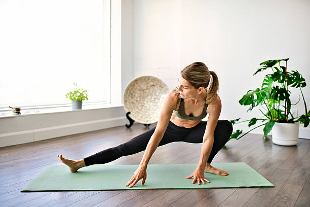 istock Nice yoga teacher woman in a studio indoors 2245360301