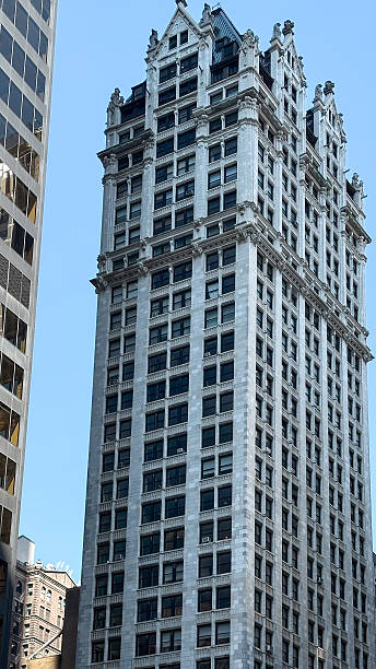 istock Historic skyscraper with ornate architecture amidst modern build 2245362367
