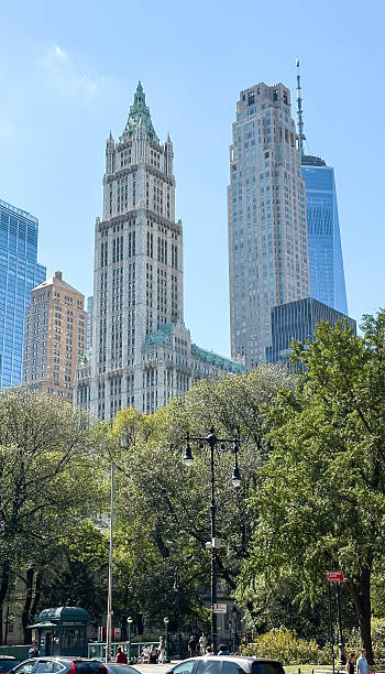 istock Woolworth building and one world trade center amidst greenery on 2245362418