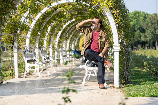 Senior active businessman enjoys the autumn