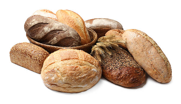 istock Different types of bread and wheat spikes isolated on white 2245365395