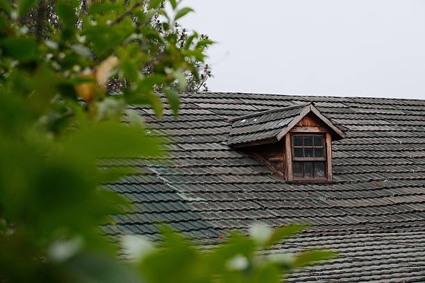 istock Old Wooden Dormer Window on Tiled Roof 2245370030