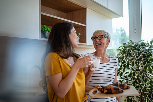 istock Mother and daughter enjoying breakfast together in kitchen 2245370901
